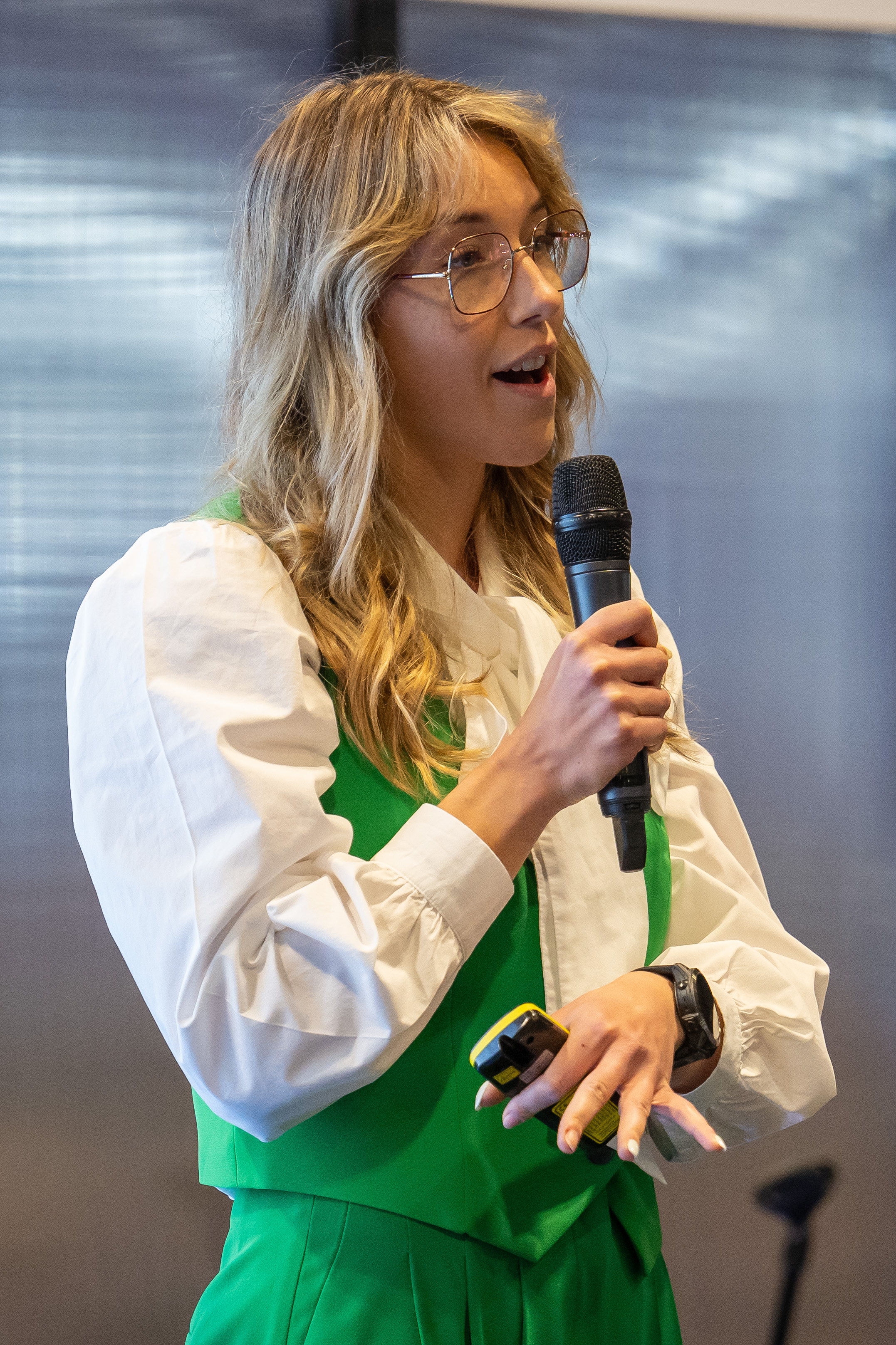 Jane Wright speaking into a microphone at CyberUK